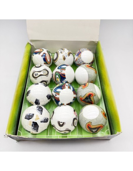 CAPSULA 70MM MUNDIAL CON MINITOY DE GOMA Y TAZO.